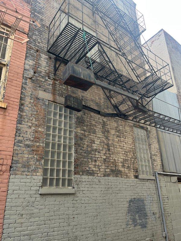 Conducted site assessment of existing rooftop R-22 commercial air conditioning system experiencing low refrigerant levels. Evaluated condenser unit condition, noting significant dirt accumulation on protective grille and aged equipment requiring replacement due to obsolete refrigerant type and system deterioration. Provided comprehensive replacement estimate for new commercial HVAC system installation.