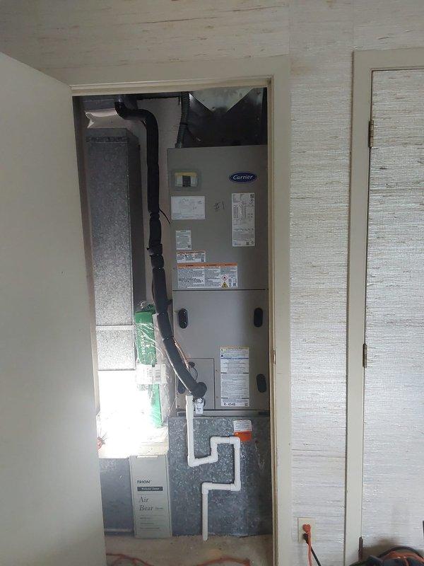 Completed full dual-zone HVAC system replacement including two rooftop heat pump units (Legacy 2.0-ton and 2.5-ton models utilizing R454B refrigerant) and two indoor FJ5 fan coil air handlers installed in utility closets. Installed two 10kw heat kits in the new air handlers to provide supplemental heating capacity. Replaced both thermostats to ensure proper system control and operation.

Purged linesets with nitrogen and performed comprehensive pressure leak testing to verify system integrity prior to charging. Reconfigured return air drop for the bedroom closet air handler to optimize airflow distribution for the new equipment specifications. Replaced filter rack on bedroom closet unit to accommodate new system requirements.

Installed new electrical disconnect boxes with fuses at both outdoor units to meet current code requirements. Replaced Bryant bypass humidifier on the hallway system to maintain proper indoor humidity levels. Reconnected both air handlers to existing drain lines 