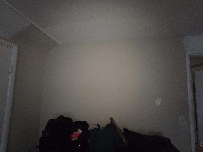 Conducted on-site assessment for mini-split installation in upper-level room with sloped ceiling. Evaluated space layout, electrical access, and optimal placement for indoor air handler unit to ensure efficient heating and cooling coverage for the attic bedroom area.