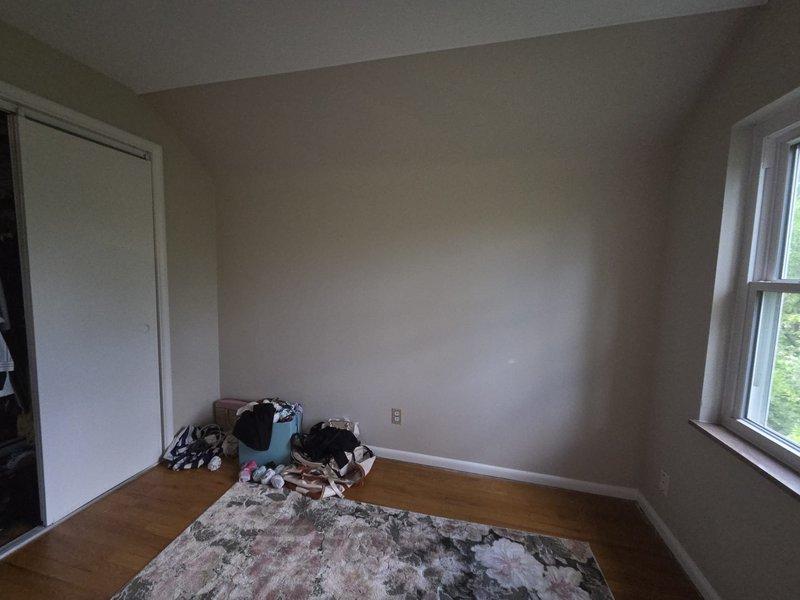Conducted on-site assessment for mini-split installation in upper-level room with sloped ceiling. Evaluated space layout, electrical access, and optimal placement for indoor air handler unit to ensure efficient heating and cooling coverage for the attic bedroom area.