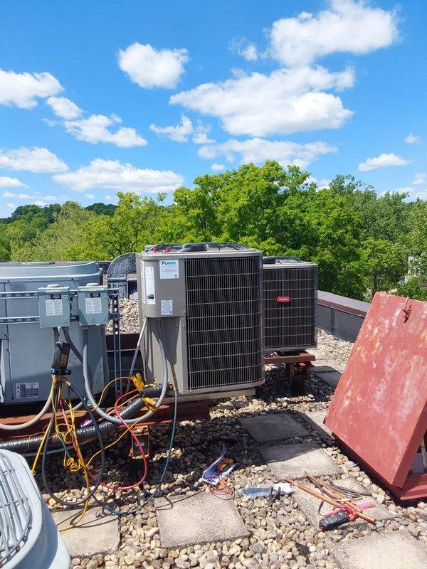 Completed full HVAC system replacement including a Bryant Legacy 2.5-ton 135SAN03000W condensing unit on roof and FJ5ANXB30L00 fan coil in utility closet utilizing R454B refrigerant. Crane service was utilized to remove existing rooftop condenser and install new unit. Reconnected system to existing return air box, copper lineset, and drain line while installing new heat kit in air handler. Performed nitrogen purge of lineset followed by pressure leak test to verify system integrity. Replaced electrical disconnect box with new fuses, installed new wet switch and overflow switch for condensate safety, and integrated existing thermostat with new equipment. Installed Bryant bypass humidifier with connection to available water supply in closet. System tested and operational upon completion.