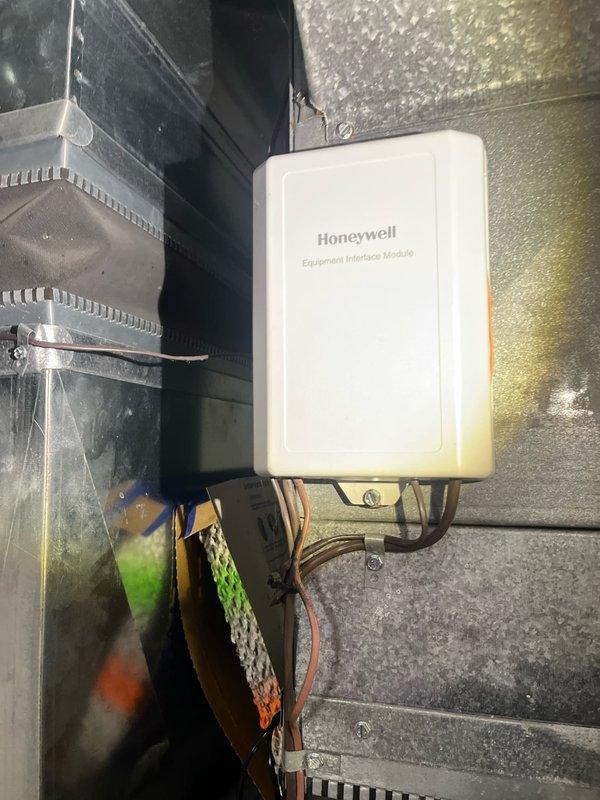 Conducted comprehensive site evaluation for geothermal HVAC system replacement at residential property. Assessed existing attic-mounted air handler unit with Honeywell Equipment Interface Module, ductwork configuration, and insulated supply lines to determine system integration requirements. Evaluated exterior electrical service capacity at meter and disconnect panel to verify adequate power supply for geothermal heat pump installation and documented site conditions for equipment sizing and placement recommendations.