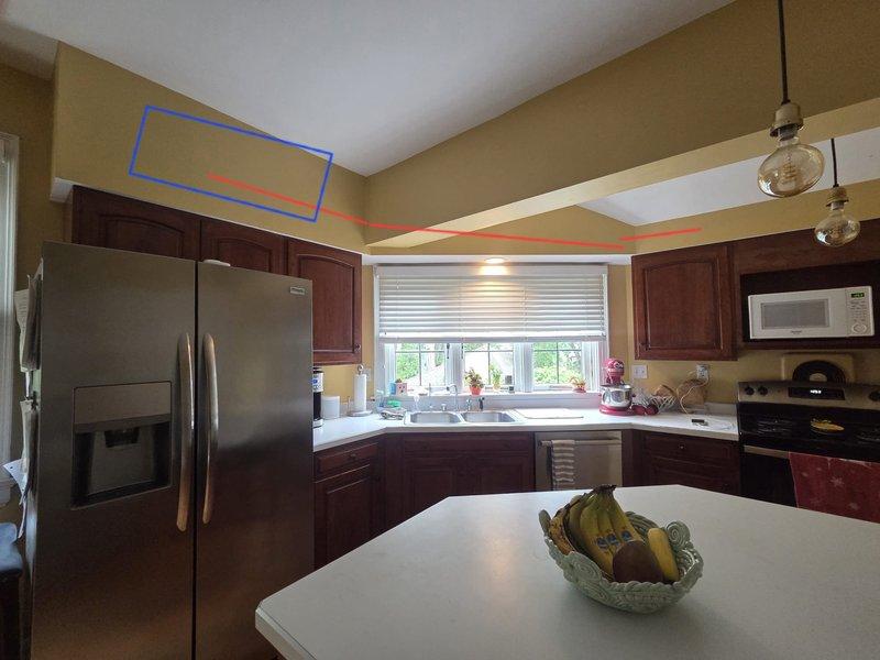 Conducted on-site assessment for mini-split system installation in residential kitchen area. Performed laser measurements of installation space to determine optimal placement and sizing requirements for one to two mini-split units. Documented existing kitchen layout and ceiling configuration to evaluate mounting options and refrigerant line routing for proposed ductless HVAC system.