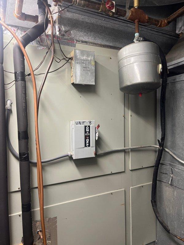 Conducted comprehensive assessment of commercial HVAC system designated as Unit 3 to provide replacement estimate for air conditioning and gas furnace equipment. Evaluated existing cabinet-style air handler unit, associated ductwork, expansion tank, copper piping infrastructure, electrical disconnect components, and mechanical room configuration. Documented current system conditions including equipment age, operational status, and integration with building plumbing and electrical systems. Photographed all relevant equipment, piping connections, control boxes, and utility space layout to support accurate replacement specifications and installation planning.