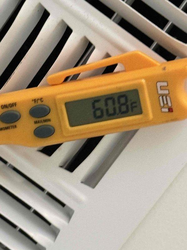 Responded to callback for no cooling issue following recent installation. Upon arrival, verified thermostat set to 72°F in cooling mode with system actively running. Measured supply air temperature at 60.8°F at register, confirming adequate cooling performance and proper system operation. System found functioning as designed with no deficiencies noted.