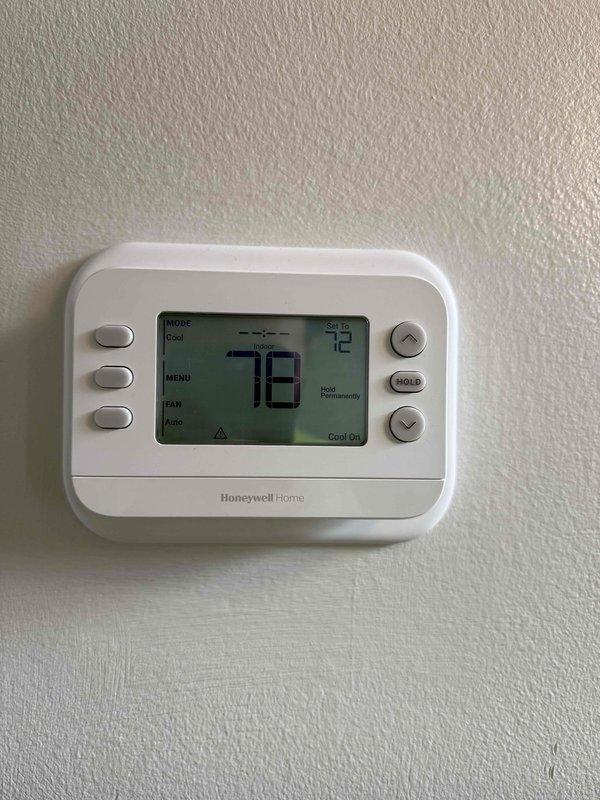 Responded to callback for no cooling issue following recent installation. Upon arrival, verified thermostat set to 72°F in cooling mode with system actively running. Measured supply air temperature at 60.8°F at register, confirming adequate cooling performance and proper system operation. System found functioning as designed with no deficiencies noted.