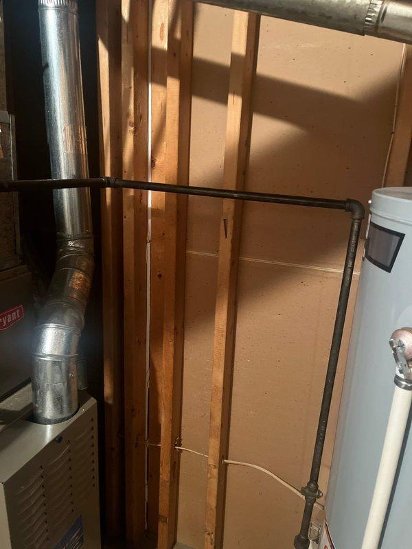 Completed estimate for replacement of gas furnace and air conditioning system. Evaluated existing Quantum-branded outdoor condenser unit and indoor furnace installation in mechanical room with exposed framing. Documented current HVAC equipment configuration, ductwork routing, refrigerant lines, and electrical connections to provide comprehensive replacement options for complete system upgrade.