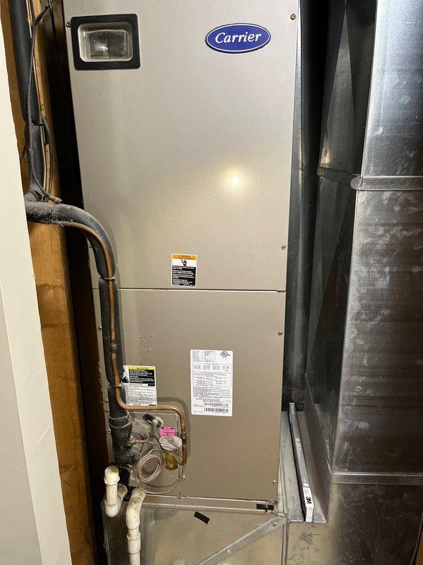 Performed comprehensive evaluation of existing 2005 Carrier HVAC system for complete furnace and air conditioning replacement. Assessed current equipment condition, ductwork integration, refrigerant line configuration, and condensate drainage system in basement mechanical room. Documented system specifications and provided replacement recommendations for both heating and cooling units to meet residential comfort requirements.