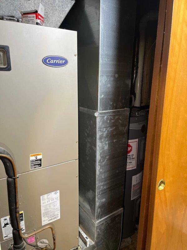 Performed comprehensive evaluation of existing 2005 Carrier HVAC system for complete furnace and air conditioning replacement. Assessed current equipment condition, ductwork integration, refrigerant line configuration, and condensate drainage system in basement mechanical room. Documented system specifications and provided replacement recommendations for both heating and cooling units to meet residential comfort requirements.