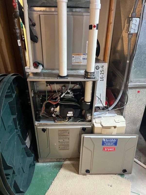 Completed estimate for complete HVAC system replacement in basement mechanical room. Evaluated existing indoor air handler unit model CNPVP3621ALAAAAA manufactured March 2017 utilizing R-410A refrigerant, along with furnace and associated Bryant equipment. Documented current system configuration including PVC venting, copper refrigerant lines, electrical connections, and overall installation conditions to provide replacement options and specifications.