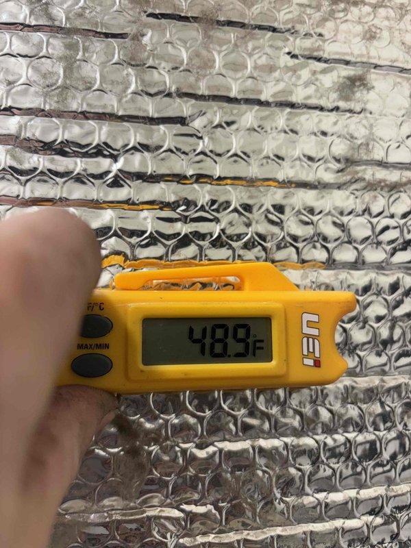 Completed flare repair on commercial HVAC refrigeration system. Performed temperature diagnostics at evaporator coil, recording supply air temperature of 48.9°F and return air temperature of 59.3°F to verify proper system operation following refrigerant line flare connection repair. System tested and confirmed operational with acceptable temperature differential across coil.