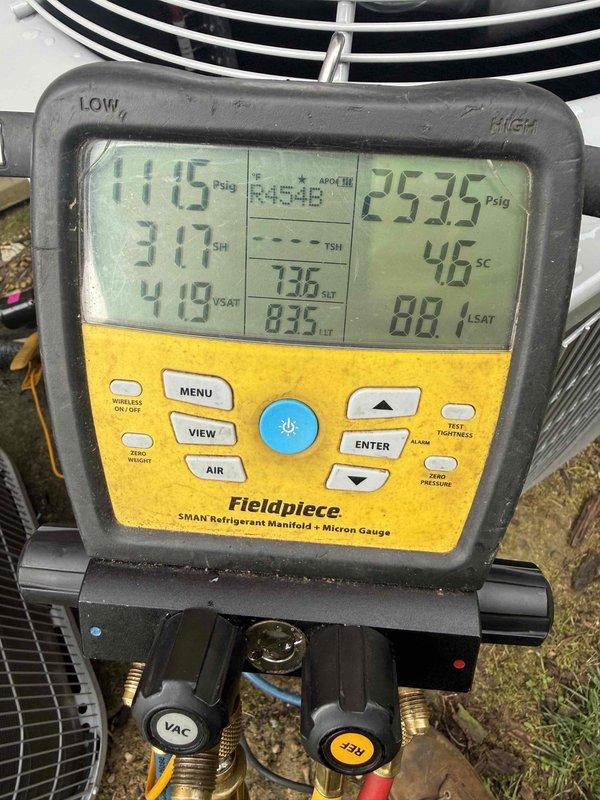 Responded to no cooling complaint on recently installed commercial air conditioning system. Upon arrival, found evaporator coil completely frozen with heavy ice buildup measuring 65.8°F surface temperature. Connected refrigerant manifold gauges and diagnosed system operating with suction pressure of 25.75 PSIG and discharge pressure of 111.5 PSIG, indicating low refrigerant charge. Subcooling measured at 31.7°F and superheat at 41.9°F confirmed undercharge condition. Thawed coil, performed leak check, added refrigerant to manufacturer specifications, and verified proper system operation with correct pressures and temperatures before departure.