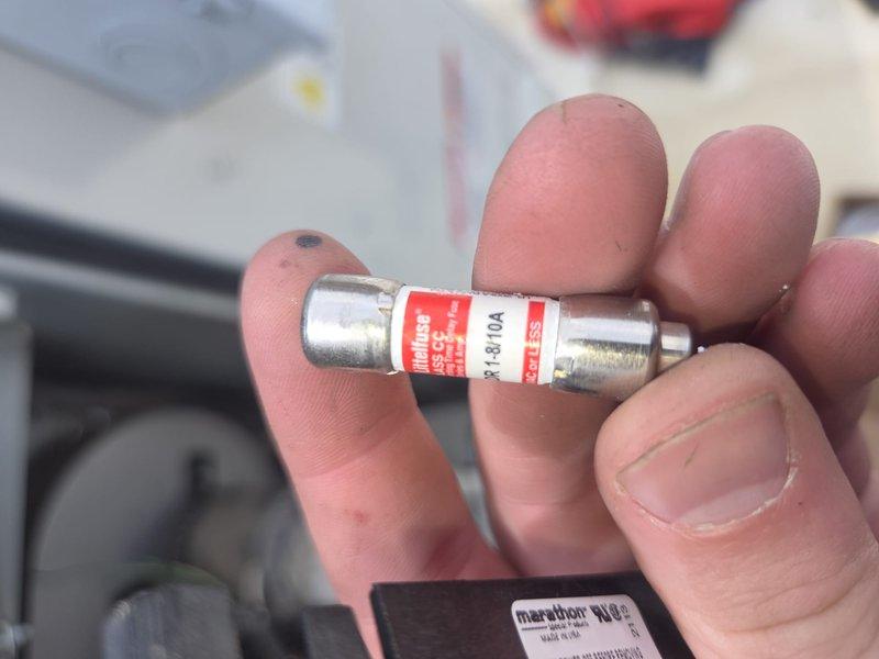 Responded to commercial rooftop unit (RTU-1) service call and diagnosed electrical issue. Upon inspection, identified failed Littelfuse KUR-1-8/10A fuse in the unit's control circuit. Replaced defective fuse with new 10-amp fuse to restore proper electrical operation and return unit to service.