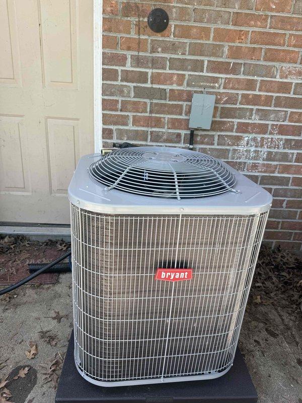 Completed full HVAC system replacement at commercial facility, installing a new Bryant 2-ton 14 SEER condensing unit with R-454B refrigerant on outdoor pad with disconnect and whip, paired with First Company hot water fan coil air handler and Honeywell thermostat. Flushed existing refrigerant lines for reuse, properly disposed of old equipment per EPA regulations, obtained necessary permits, and verified system operation upon completion.
