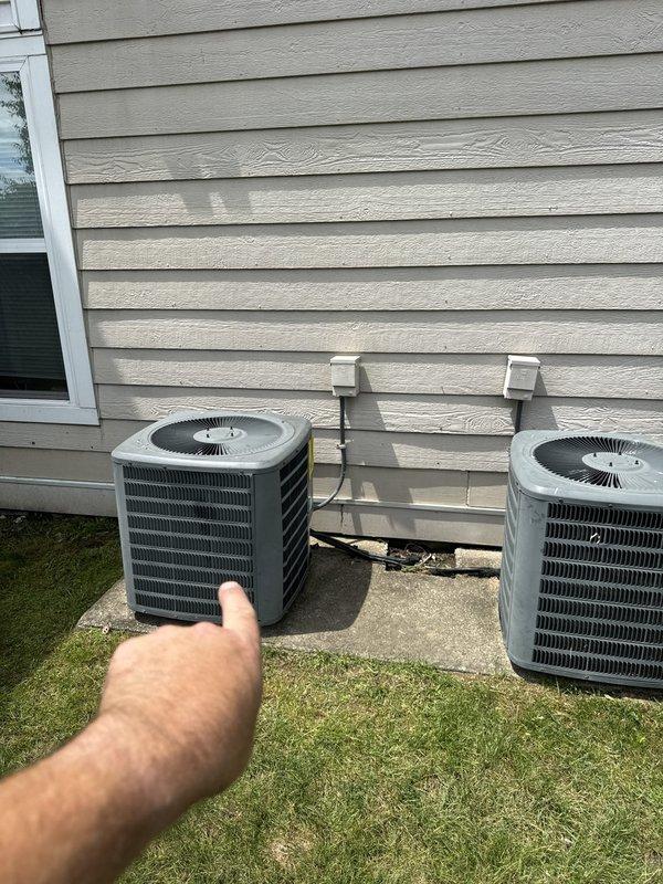 Responded to no cooling call at commercial property. Upon arrival, inspected electrical panel and verified circuit breaker status for affected AC unit. Found tripped breaker, reset circuit, and confirmed power restoration to condenser unit. Verified both outdoor condensing units operational with proper fan operation and normal system startup. System restored to full cooling capacity.