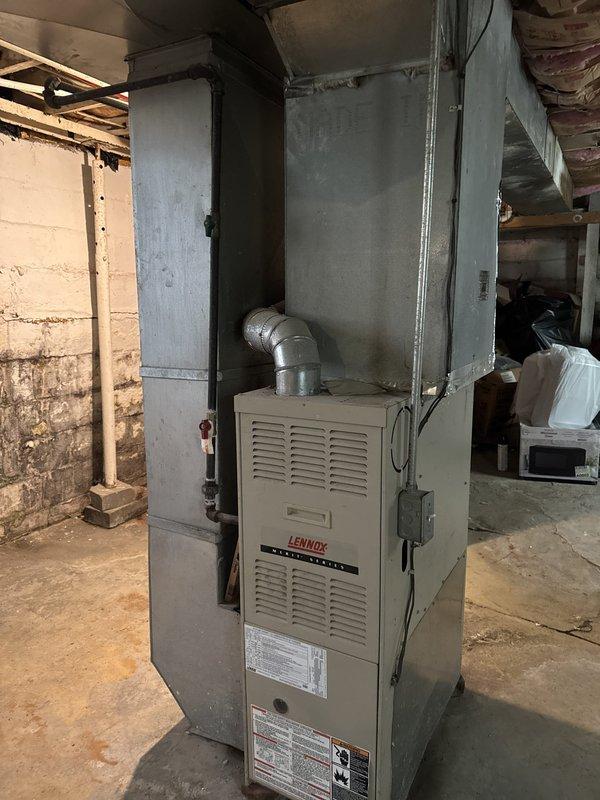 Responded to no cooling complaint on 15-year-old commercial air conditioning system. Upon arrival, performed comprehensive system inspection of Lennox furnace and outdoor condensing unit. Conducted refrigerant pressure testing and leak detection procedures to address customer's concern regarding possible refrigerant leak. Inspected condenser coils, fan operation, and electrical connections at outdoor unit. Evaluated airflow and temperature differential across evaporator coil. System assessed and diagnostic findings documented with photographic evidence of equipment condition.