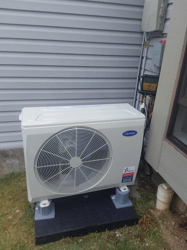 Completed full HVAC system installation including removal and disposal of existing equipment. Installed FT5ANXB24L00 fan coil with R454B refrigerant, 37MUHAQ24AA3 single-zone ductless outdoor heat pump unit, and TU-EC-08BKB 8kW electric heat kit. Installed new equipment pad, electrical whip, and disconnect at outdoor unit location. All equipment tested and operational upon completion.