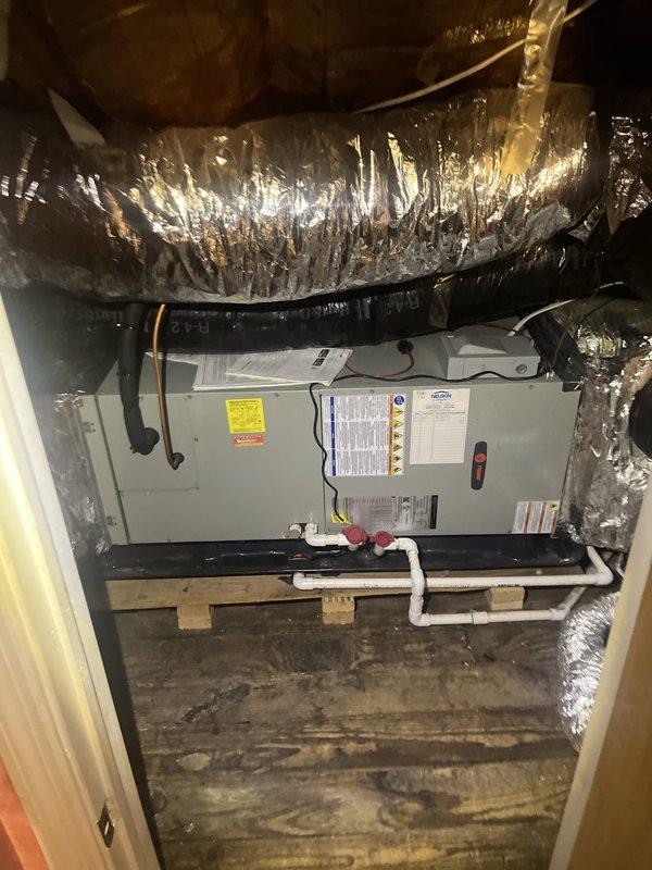 Conducted on-site evaluation for boiler removal and system replacement. Assessed existing basement boiler installation, including vertical ductwork configuration with galvanized and metallic ducts mounted against concrete block wall. Inspected current HVAC air handler unit located in attic space with associated flexible ductwork, PVC condensate drainage, and electrical connections. Documented equipment specifications, spatial constraints, and mechanical system layout to provide comprehensive replacement options. Photographed existing installations to support estimate preparation for complete system conversion.
