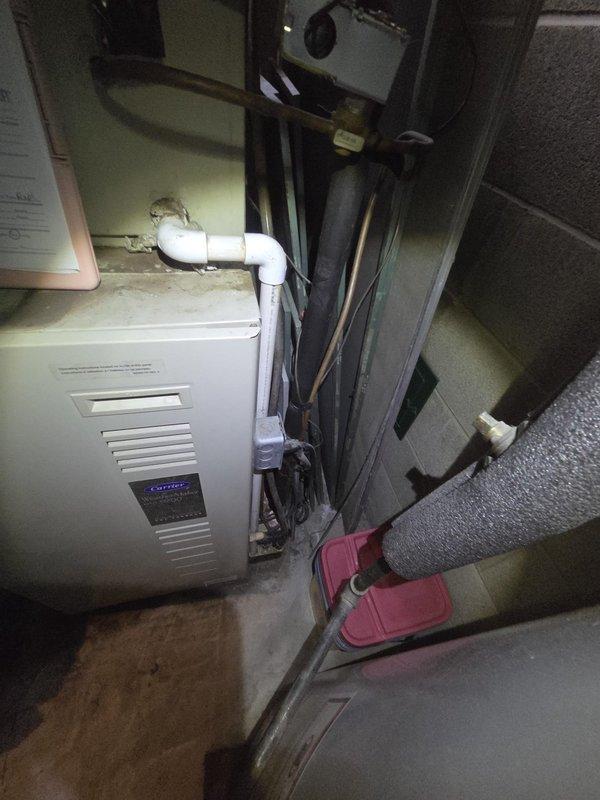 Conducted comprehensive estimate for complete HVAC system replacement of 30-year-old existing furnace and air conditioning equipment. Evaluated current Carrier heating unit and associated ductwork installation in basement utility area, noting standard flexible duct connections and refrigerant line configurations. Provided two separate equipment replacement quotes per customer request: one option maintaining existing outdoor condenser location and an alternative option relocating the outdoor AC unit to the east side of the residence. Documented existing system configuration including furnace positioning, PVC venting, electrical connections, and current ductwork layout to determine optimal replacement specifications and installation requirements.