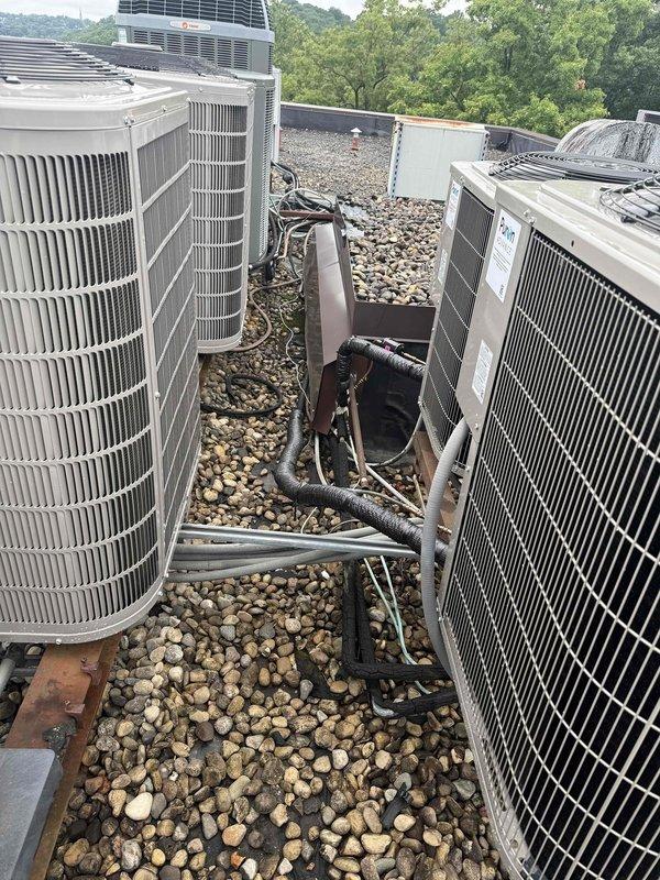Responded to inspection callback for heat pump refrigerant line insulation correction. Upon arrival, verified multiple heat pump units on rooftop installation with inadequate or deteriorating line insulation on refrigerant piping. Inspected all refrigerant lines running between condenser units and observed foam insulation with tears, wear, and exposed copper piping in several locations. Applied proper insulation to all exposed refrigerant lines per manufacturer specifications and code requirements. Documented completed work with photographs showing corrected insulation on all heat pump refrigerant lines. System ready for final inspection approval.