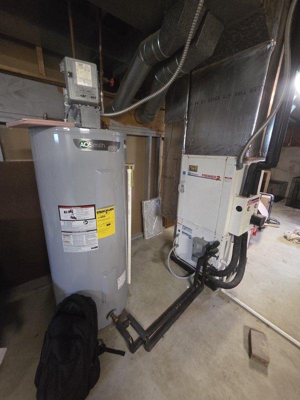 Conducted comprehensive assessment of existing HVAC system in basement utility area for air conditioning replacement estimate. Evaluated current furnace/air handler configuration, existing ductwork infrastructure including flexible and metal supply ducts, and overall system layout adjacent to water heater installation. Documented equipment specifications, spatial constraints, electrical service connections, and structural considerations for proposed AC unit replacement to provide accurate replacement recommendations and ensure proper system sizing for optimal performance.