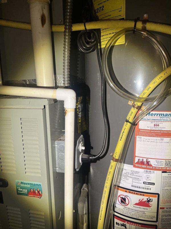 Completed estimate for air conditioning system replacement at residential property. Evaluated existing Trane HVAC unit and associated mechanical equipment located in interior utility closet, including air handler, ductwork connections, and integrated systems. Assessed current installation configuration with white PVC condensate piping, flexible duct connections, electrical wiring, and gas line routing to provide comprehensive replacement options and recommendations.
