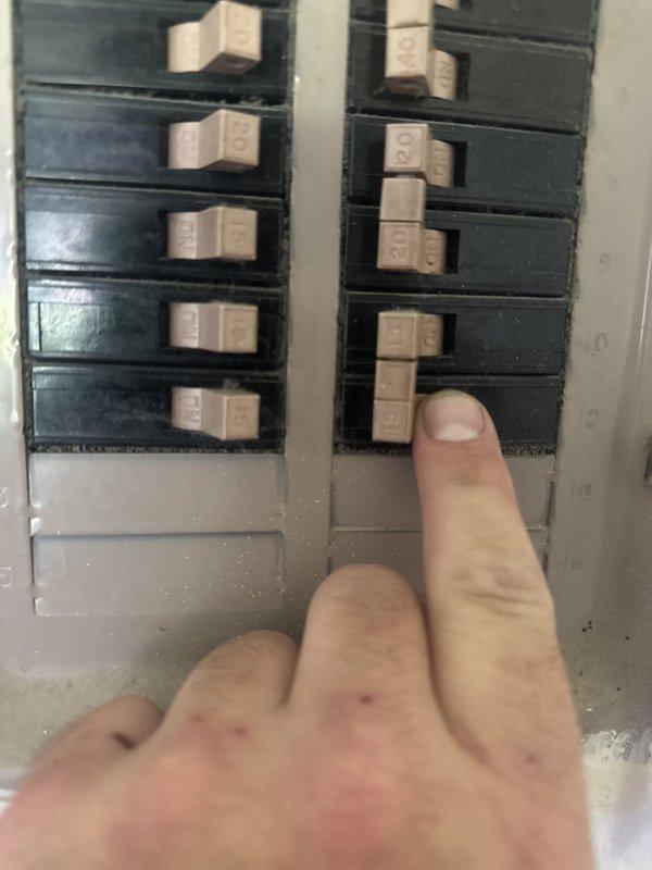 Responded to no cooling complaint at commercial facility with multiple rooftop HVAC units. Upon arrival, inspected rooftop packaged air conditioning systems and traced issue to electrical panel serving affected unit. Reset tripped circuit breaker at electrical distribution panel, restoring power to unit and returning system to normal operation.