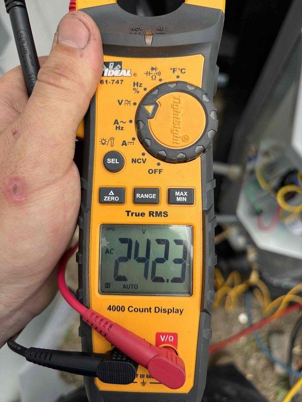Replaced condenser unit under warranty at commercial facility. Verified electrical readings with clamp meter showing 7.12A and 24.23A on respective circuits, confirming proper amperage draw and system operation upon completion.