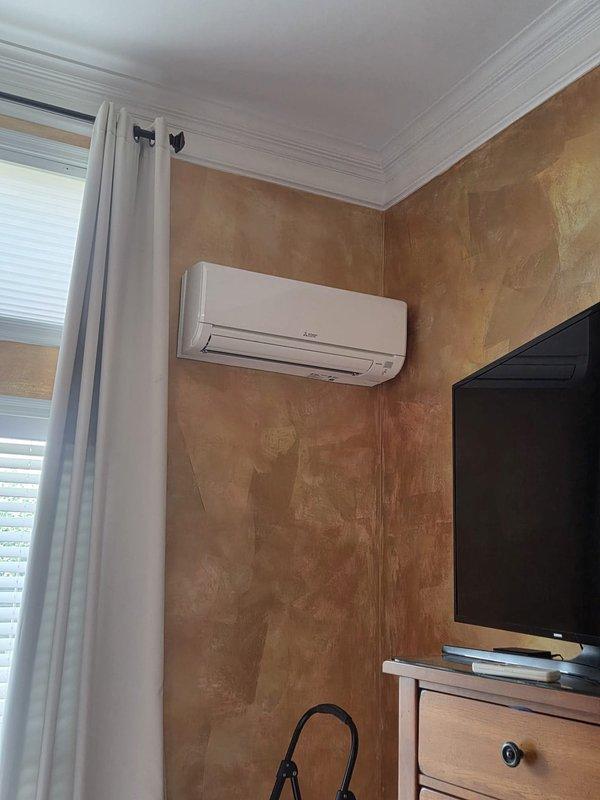 Conducted on-site assessment for air conditioning system replacement estimate. Evaluated existing ductless mini-split unit currently installed in residential living space and inspected electrical panel configuration including dedicated 50-amp AC circuit breaker. Documented current system placement, electrical infrastructure, and interior mounting locations to provide comprehensive replacement options and equipment specifications.