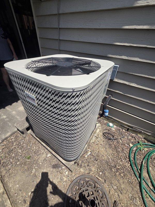 Conducted comprehensive evaluation of existing HVAC system for full replacement estimate. Assessed outdoor condensing unit with diamond-pattern grille positioned on concrete pad, noting copper refrigerant line routing and service port accessibility. Documented current Honeywell digital thermostat configuration and control system for replacement specifications.