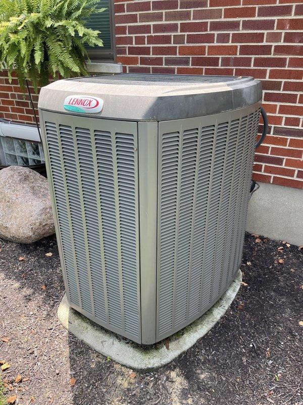 Completed estimate for full HVAC system replacement at residential property. Evaluated existing Lennox outdoor condensing unit located on concrete pad adjacent to brick exterior wall and assessed indoor air handler with associated refrigerant lines, PVC condensate drainage system, and ductwork in mechanical space. Documented current system configuration including copper line sets, drainage components, and equipment placement for replacement proposal.