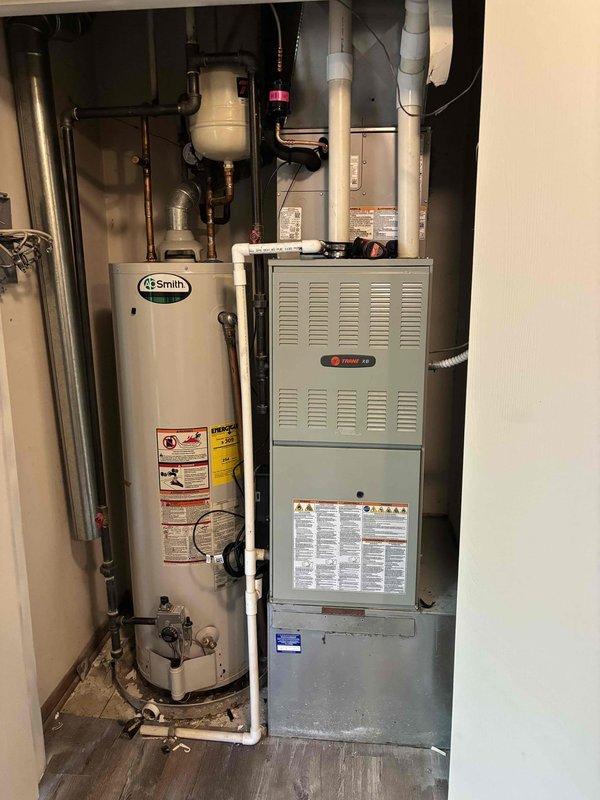 Completed commercial HVAC installation of a Bryant GA4SAN52400N 2-ton 14 SEER condenser unit with R-454B refrigerant and CVAVA2417 evaporator coil. Flushed and reused existing refrigerant lines, fabricated sheet metal connections to integrate with existing supply and return ductwork, and installed outdoor disconnect with whip, pad, and fuses. System was tested, charged to manufacturer specifications, and verified operational with all required permits obtained.