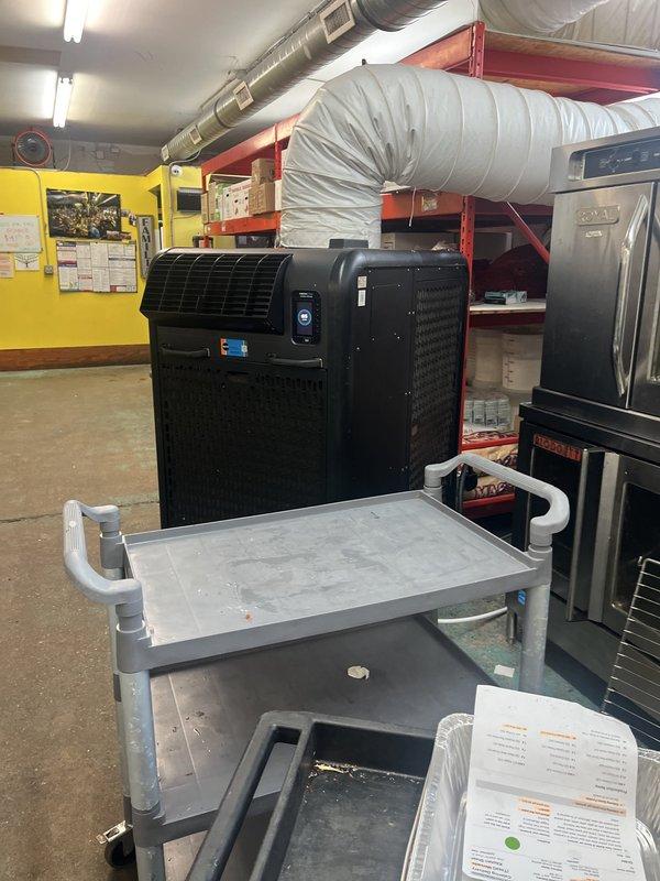 Conducted estimate for commercial HVAC system serving restaurant and warehouse facility experiencing inadequate cooling capacity. Evaluated existing rooftop unit (RTU) performance and assessed two potential solutions: replacing current unit with higher-capacity system or installing additional RTU to supplement existing equipment. Inspected walk-in refrigeration unit, commercial kitchen equipment, and existing ductwork infrastructure. Documented current system configuration including ventilation equipment and air distribution components. Provided recommendations for upgrading cooling capacity to meet facility demands.