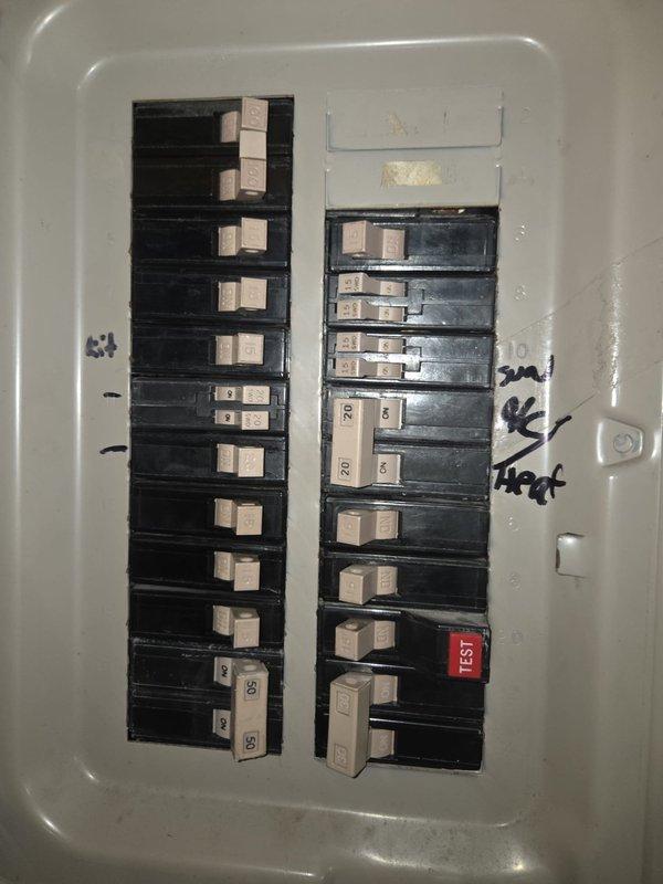 Conducted estimate for complete HVAC system replacement at residential property where existing unit is non-operational and customer is currently relying on portable cooling units. Assessed electrical infrastructure including main breaker panel with mixed circuit breaker configuration and documented current 220-volt power supply location approximately 6 feet from required disconnect position for new equipment installation. Replacement will require relocation of existing 220-volt electrical connection to proper disconnect location to meet code requirements and equipment specifications.