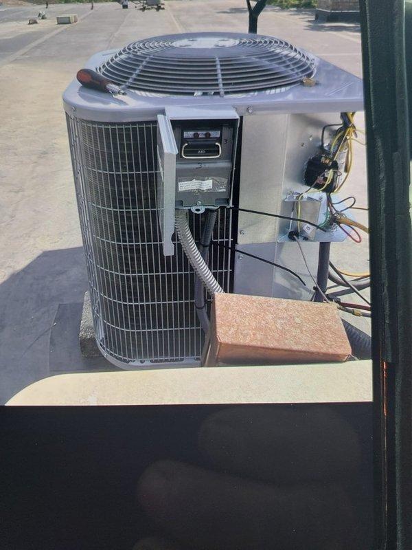Completed commercial HVAC system installation on rooftop location, installing ADP BCRMA2124S3N3 condensing unit with protective wire grille guard and Bryant GA4SAN524 air handler relocated to closet space. Disconnected and removed existing equipment, installed new electrical disconnect with fuses, whip, and flexible metal conduit for proper power supply to new system. Verified all electrical connections, tested system operation, and ensured proper airflow through condensing unit fan assembly.
