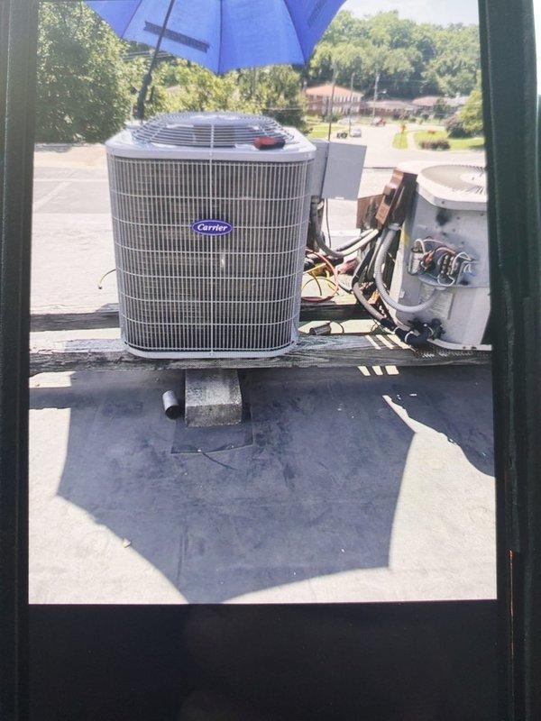 Completed commercial HVAC system installation on rooftop location, installing ADP BCRMA2124S3N3 condensing unit with protective wire grille guard and Bryant GA4SAN524 air handler relocated to closet space. Disconnected and removed existing equipment, installed new electrical disconnect with fuses, whip, and flexible metal conduit for proper power supply to new system. Verified all electrical connections, tested system operation, and ensured proper airflow through condensing unit fan assembly.