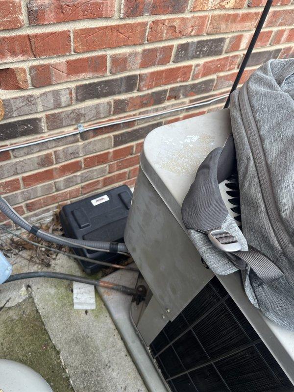 Performed comprehensive assessment of aging commercial R-22 HVAC system experiencing inadequate cooling capacity. Evaluated outdoor condensing unit positioned against building exterior and inspected indoor air handling components in basement mechanical room. System currently operational but unable to maintain desired temperature setpoints due to obsolete refrigerant technology and equipment age. Documented existing equipment configuration including outdoor unit with deteriorating housing, electrical disconnect, and indoor ductwork with visible condensation issues. Provided detailed replacement estimate for complete system upgrade to modern, efficient equipment compatible with current refrigerant standards to restore proper cooling performance and ensure regulatory compliance.