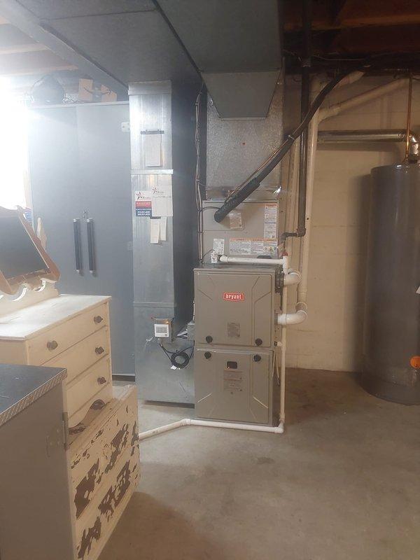 Completed full HVAC system installation including a 916SA48060M17 97% AFUE single-stage gas furnace with constant torque ECM motor, 37MURAQ24AA3 ductless outdoor unit for single-zone application, and CVAVA2417XMA cased vertical V-coil evaporator compatible with R454B refrigerant. Performed nitrogen purge and pressure leak test on refrigerant lineset to ensure system integrity, installed new outdoor condenser pad, replaced disconnect box with new fuses, reconnected system to existing ductwork, and installed new thermostat for system control.