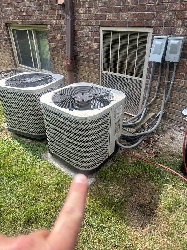Responded to no cooling call at multi-unit commercial property. Upon arrival, inspected three outdoor condenser units positioned on concrete pads along exterior brick wall. Verified electrical supply by checking circuit breakers in main electrical panel, identifying dedicated circuits rated at various amperages serving the HVAC equipment. Documented electrical disconnect boxes and conduit routing from condensers to building electrical system. Photographed equipment configuration and electrical panel for service records.