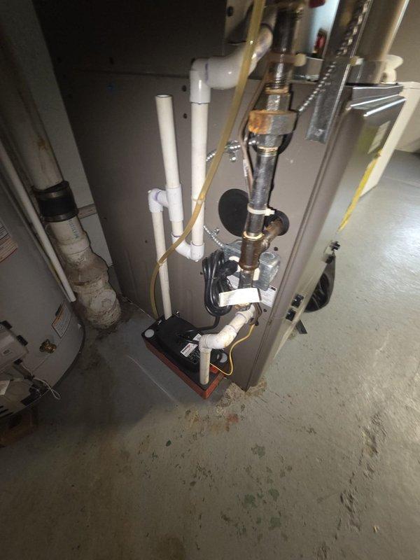 Performed comprehensive estimate for replacement of 15-year-old air conditioning and furnace system experiencing inadequate cooling capacity and elevated indoor humidity levels. Evaluated existing HVAC equipment in mechanical room, documented current furnace unit with associated PVC condensate drainage, ductwork connections, and refrigerant lines. Provided replacement recommendations and system sizing options to address comfort deficiencies and improve dehumidification performance.