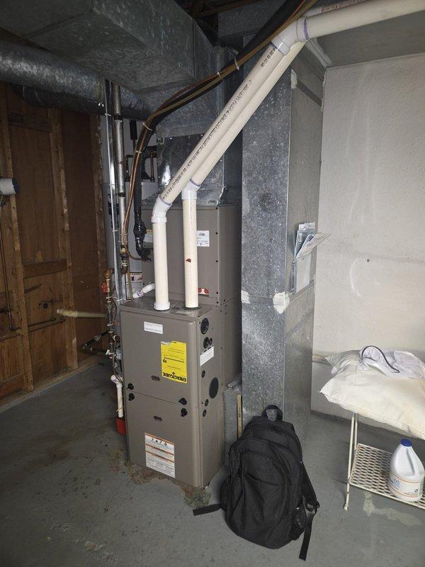 Performed comprehensive estimate for replacement of 15-year-old air conditioning and furnace system experiencing inadequate cooling capacity and elevated indoor humidity levels. Evaluated existing HVAC equipment in mechanical room, documented current furnace unit with associated PVC condensate drainage, ductwork connections, and refrigerant lines. Provided replacement recommendations and system sizing options to address comfort deficiencies and improve dehumidification performance.