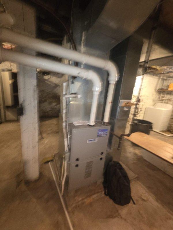 Conducted estimate for air conditioning system experiencing inadequate cooling performance. Evaluated existing HVAC equipment in basement utility area, including forced-air furnace unit and associated ductwork system. Inspected electrical panel to assess current electrical service capacity and circuit breaker configuration for potential system replacement requirements. Documented existing equipment conditions including furnace cabinet, dual cylindrical supply ducts, horizontal return ductwork, and electrical infrastructure. Coordinated estimate details with property owner while meeting with tenant on-site to discuss cooling deficiencies and replacement options.