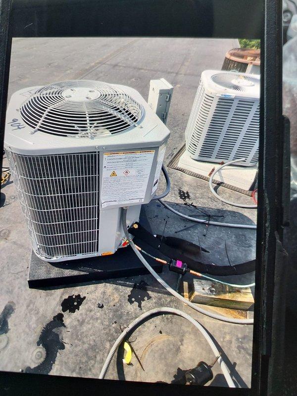 Completed full commercial HVAC system installation including Bryant GA4SAN524 air conditioning condenser unit (208-230V, 1PH, factory charged with 3.90 lbs R-454B refrigerant) and BCRMA2124S3N3 water fan coil unit on rooftop location. Connected refrigerant lines and piping to existing supply infrastructure, installed new thermostat for system control, and secured all necessary permits for commercial installation compliance.