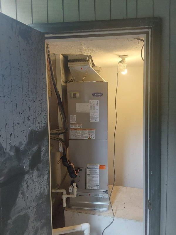 Completed full commercial HVAC system replacement including installation of Bryant GA4SAN52400 2-ton 15 SEER condenser unit utilizing R454B refrigerant and Bryant FJ5ANXB30L00 air handler with 8kW heat strip. Removed existing equipment per EPA disposal specifications and installed new condenser on concrete pad with proper disconnect, whip, and fuses. Flushed existing lineset and connected to new equipment. Fabricated and installed sheet metal transitions to integrate air handler with existing supply and return ductwork in utility closet. Completed all electrical connections, refrigerant piping, and condensate drainage. System tested, charged, and verified operational per manufacturer specifications with proper airflow and temperature differentials across both heating and cooling modes.