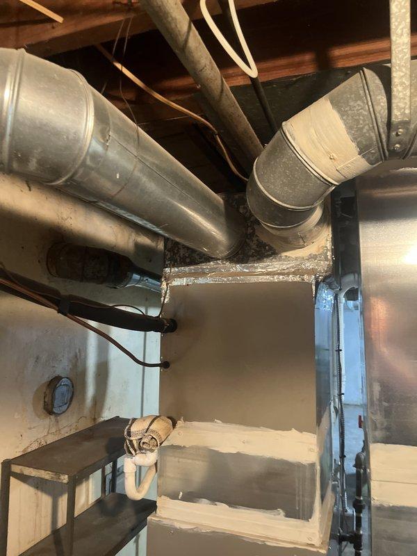 Conducted comprehensive assessment of existing HVAC system in basement mechanical room for complete system replacement. Evaluated current furnace unit, ductwork configuration, and associated mechanical components to provide detailed replacement estimate. Documented existing equipment condition, duct layout with galvanized metal runs, copper refrigerant lines, and electrical connections to determine proper sizing and installation requirements for new system.