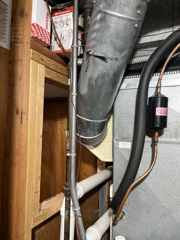 Conducted comprehensive assessment of existing HVAC system for replacement estimate. Evaluated indoor air handler unit located in utility closet with vertical ductwork configuration and existing refrigerant lines, as well as outdoor condenser unit positioned at building exterior. Documented current system components, installation conditions, and spatial constraints to provide accurate replacement recommendations.