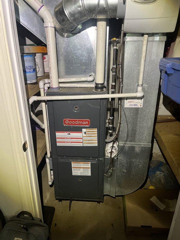 Conducted comprehensive HVAC system evaluation for replacement estimate at residential property. Assessed existing Goodman furnace installation including connected ductwork, plenum configuration, Aprilaire humidifier unit, PVC condensate drainage system, and flexible metallic supply ducts. Documented current equipment specifications, installation conditions, and system components through detailed photography to provide accurate replacement recommendations and ensure proper sizing for new equipment installation.