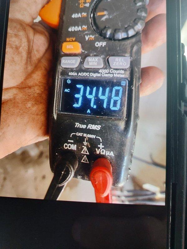 Completed full commercial HVAC system installation including FJ5ANXA18L00 unit and NCP5184000 8KW electric heater. Performed combustion analysis testing showing proper operation with readings of 20.5 on analyzer, and verified electrical draw at 34.48 amps AC using digital clamp meter to confirm system specifications and safe operation.