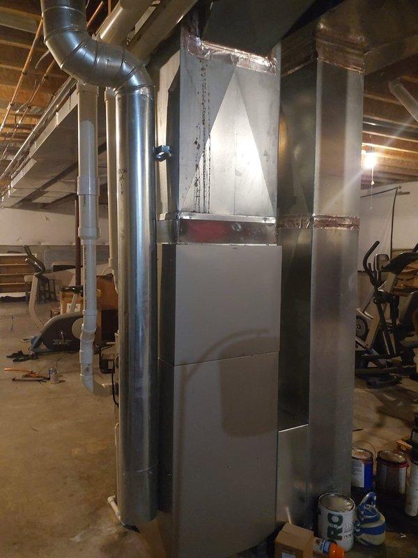 Completed full HVAC system installation including 927TA60100V21 Preferred gas furnace, 37MURAQ48AA3 ductless outdoor unit, and CVAVA4221XMA V-coil cased vertical evaporator coil compatible with R454B refrigerant. Performed nitrogen purge and pressure leak test on lineset to verify system integrity. Installed new outdoor condenser pad, new disconnect box with fuses, and replaced filter rack with new filters. Replaced existing thermostat with new unit while retaining customer's existing humidifier. System tested and operational upon completion.