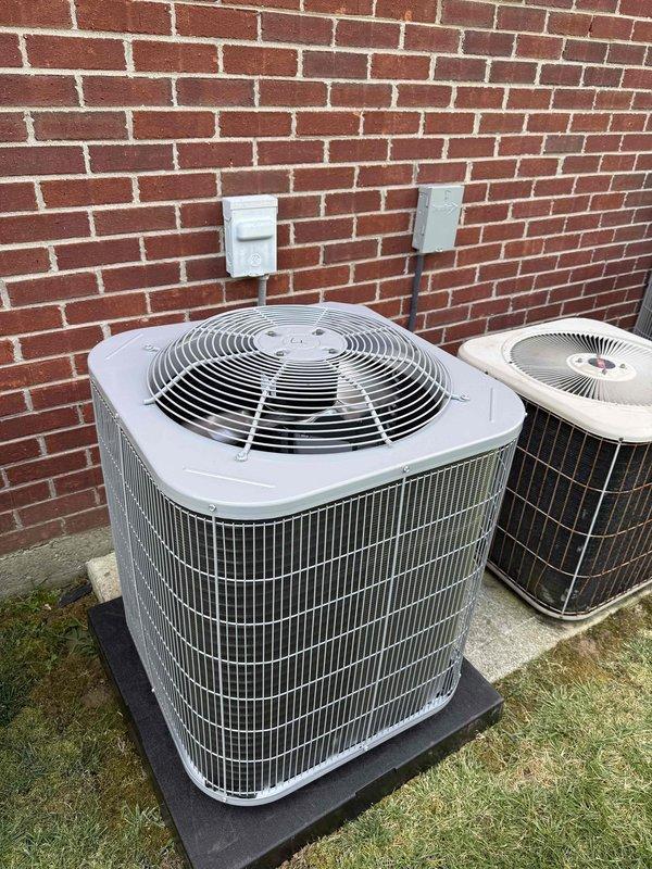 Completed commercial HVAC installation including a Bryant GA4SAN52400N 2-ton 14 SEER condenser utilizing R-454B refrigerant and CVAVA2417 evaporator coil. Flushed and reused existing refrigerant line set, fabricated and installed custom sheet metal transitions to connect new coil to existing supply and return ductwork at the Lennox furnace location. Installed outdoor disconnect with whip, pad, and fuses for the new condenser unit positioned on concrete pad against exterior brick wall. All work completed to code with proper permitting.